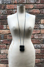 Load image into Gallery viewer, Mid 20th Century Leather Shrouded Bakerlite Double Dominoes Neckpiece

