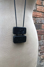 Load image into Gallery viewer, Mid 20th Century Leather Shrouded Bakerlite Double Dominoes Neckpiece
